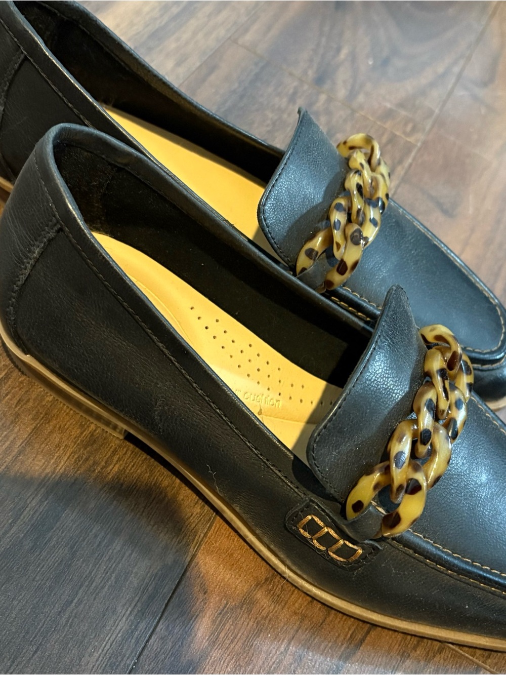 Clarks Black Leather Women's Loafers with Tortoiseshell Chain